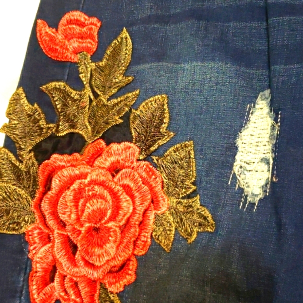 Embroidered and distressed jeans.  Size 12